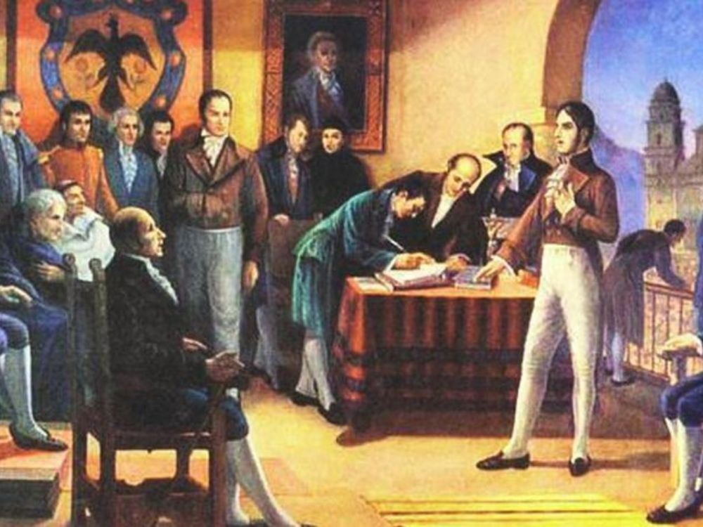 Pintura histórica del Congreso de Angostura con Bolívar de pie, rodeado de diputados en sala colonial, durante la proclamación de la Gran Colombia