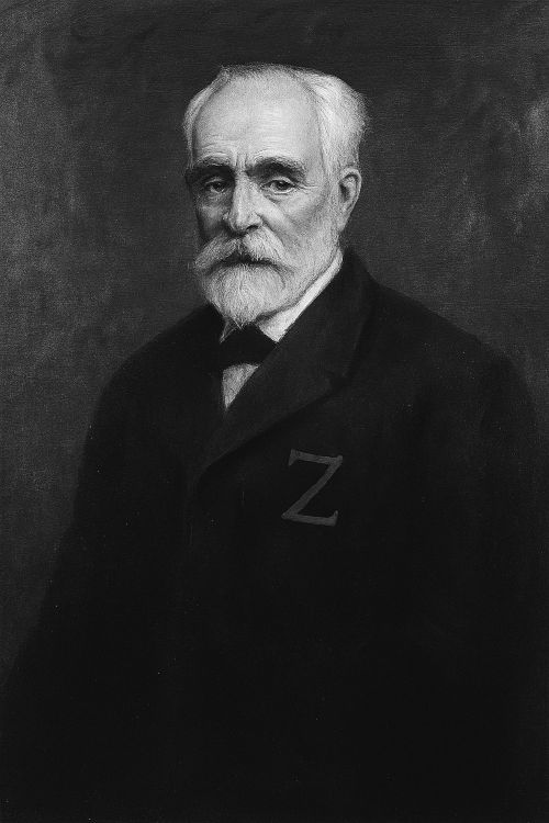 José Rodríguez Carracido Retrato en blanco y negro de José Rodríguez Carracido, vestido con chaqueta oscura que lleva bordada una “Z” simbólica en el pecho, sobre fondo neutro