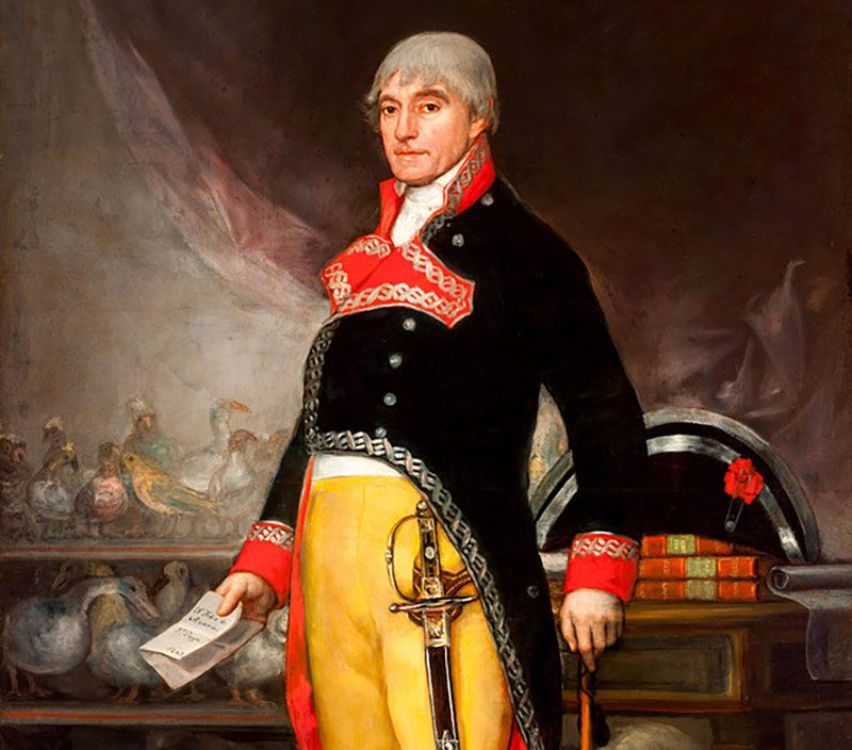 Félix de Azara Retrato pictórico de Félix de Azara, vestido con uniforme militar del siglo XVIII, de pie junto a una mesa con libros y flores. Sostiene un papel con la inscripción “Dn Félix de Azara pr Goya 1805”