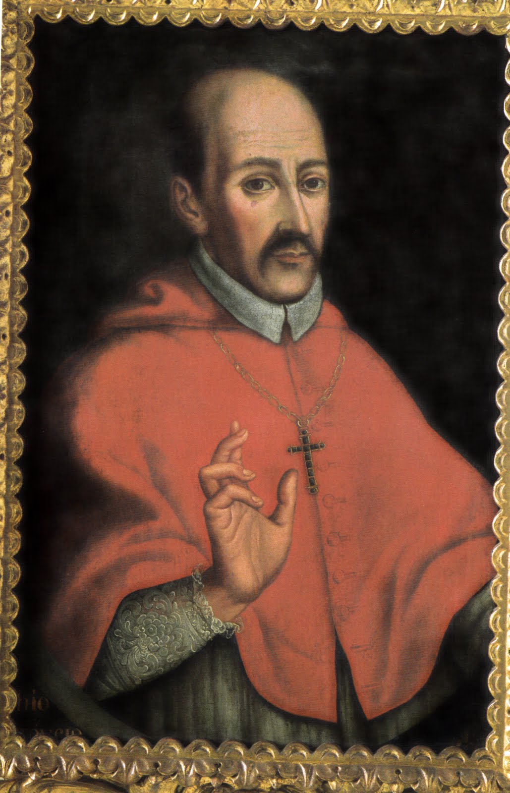 Toribio de Mogroviejo Retrato de san Toribio de Mogrovejo con vestiduras episcopales rojas y cruz dorada sobre fondo oscuro